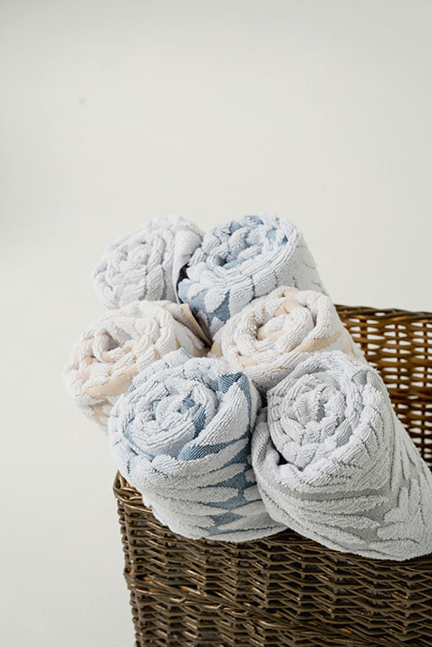 A basket of towels rolled up.