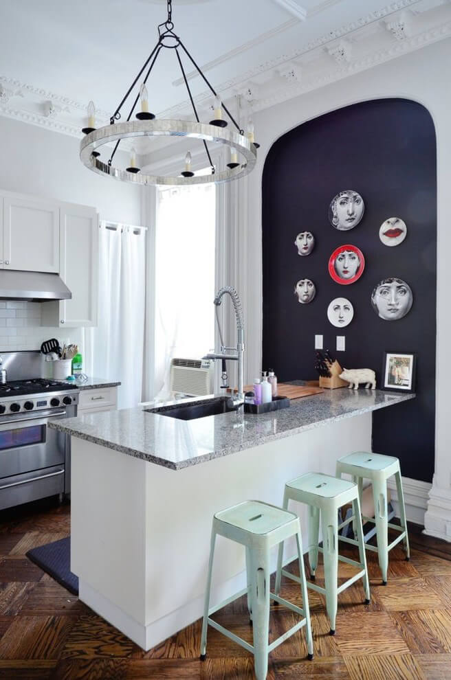 Black and white modern kitchen with a gallery wall.