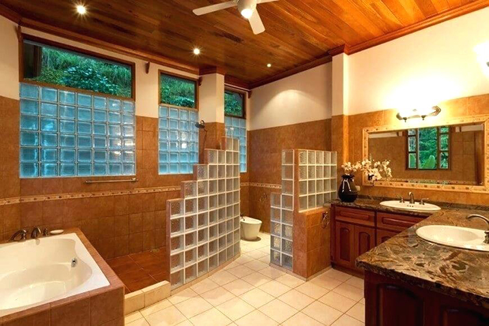 Block glass windows in the master bath tie into other elements.