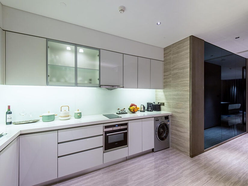 Compact kitchen in Beijing includes washer and dryer