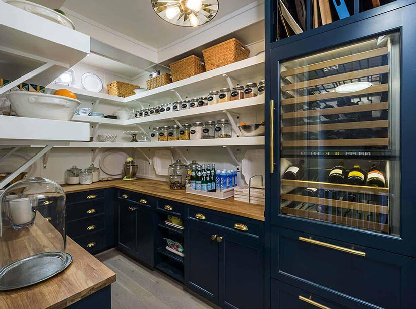 Modern farmhouse pantry with dark blue cabinets and a wine fridge.