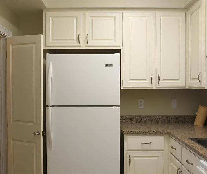Pantry cabinet door hitting refrigerator.