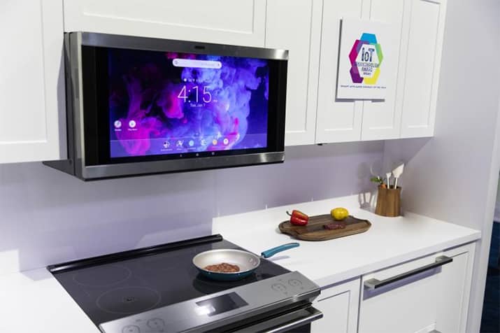 GE interactive smart kitchen hood above the cooking range.