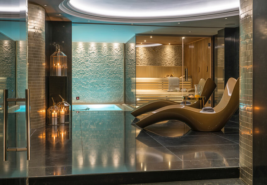 Glamorous bathroom oasis with spa and sauna.