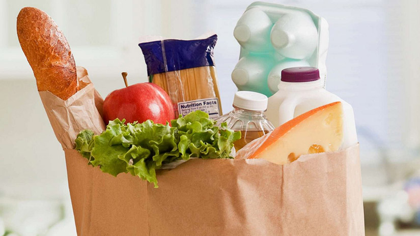 Grocery bag with a variety of food ? sanitizing groceries is important during COVID-19.