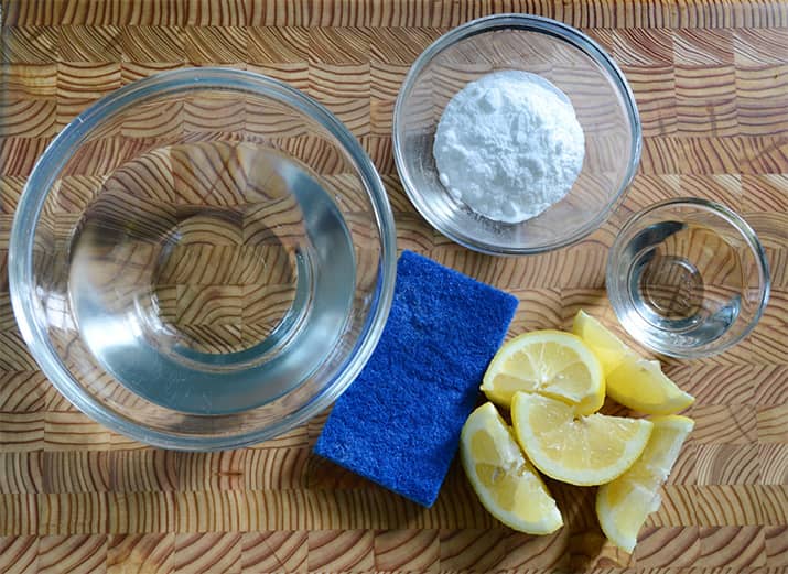 Homemade DIY grout cleaner made with lemon and baking soda.