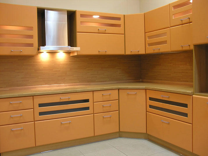 Kitchen with lights integrated into cupboards.