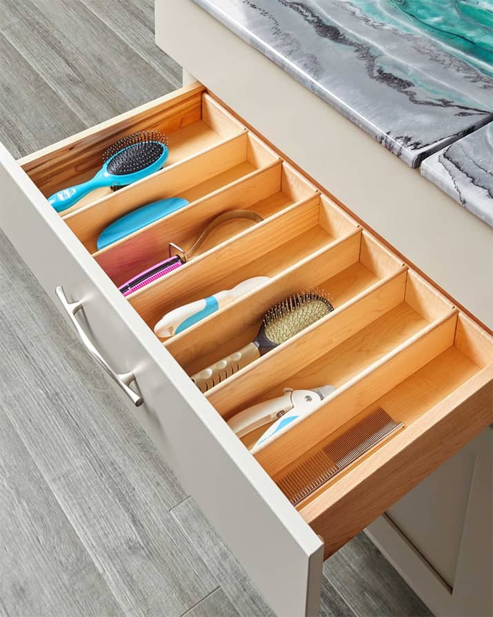 Kitchen drawer with built-in organizers to storage dog tools.
