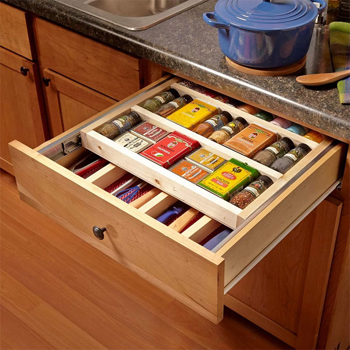 Kitchen drawer with two tiers for kitchen tools and spices.