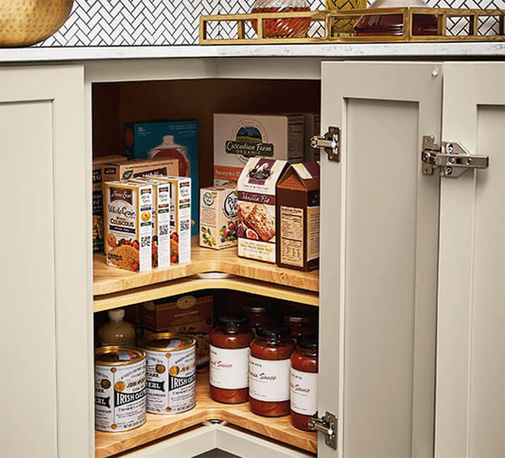 Kitchen with gray cabinets and a corner lazy susan.