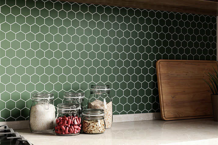 Kitchen with green hexagon backsplash tile and white grout.