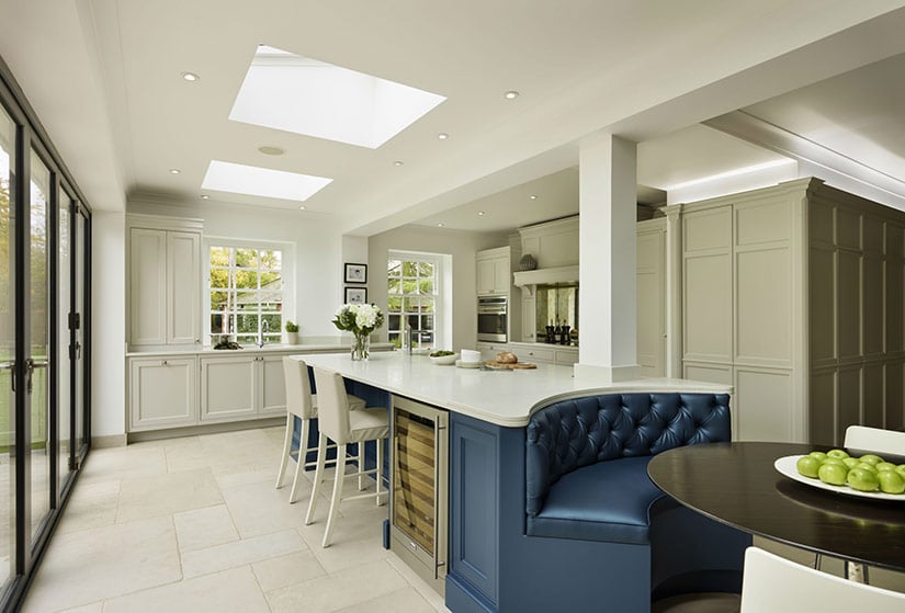 Kitchen island with small curved bench seating.