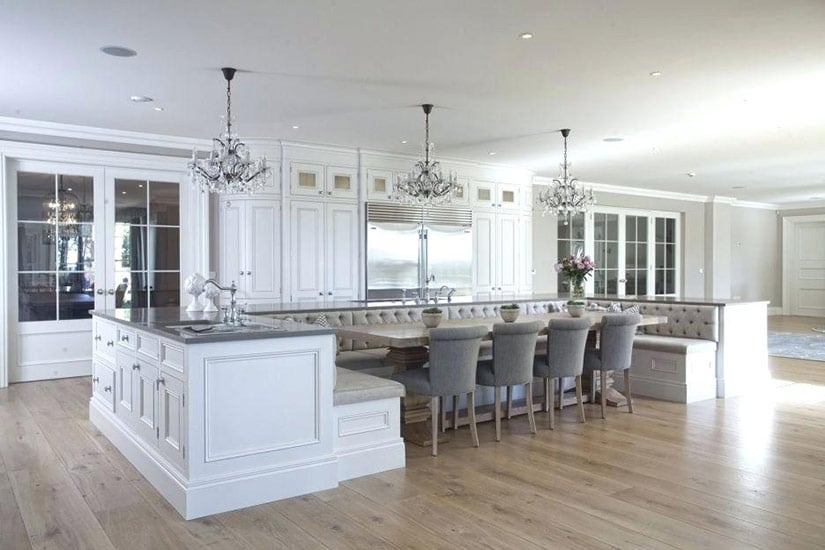 Kitchen island with wide u-shaped bench for dining table.