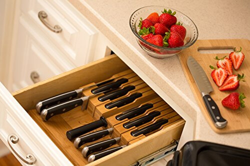 Kitchen knives stored in kitchen drawer.