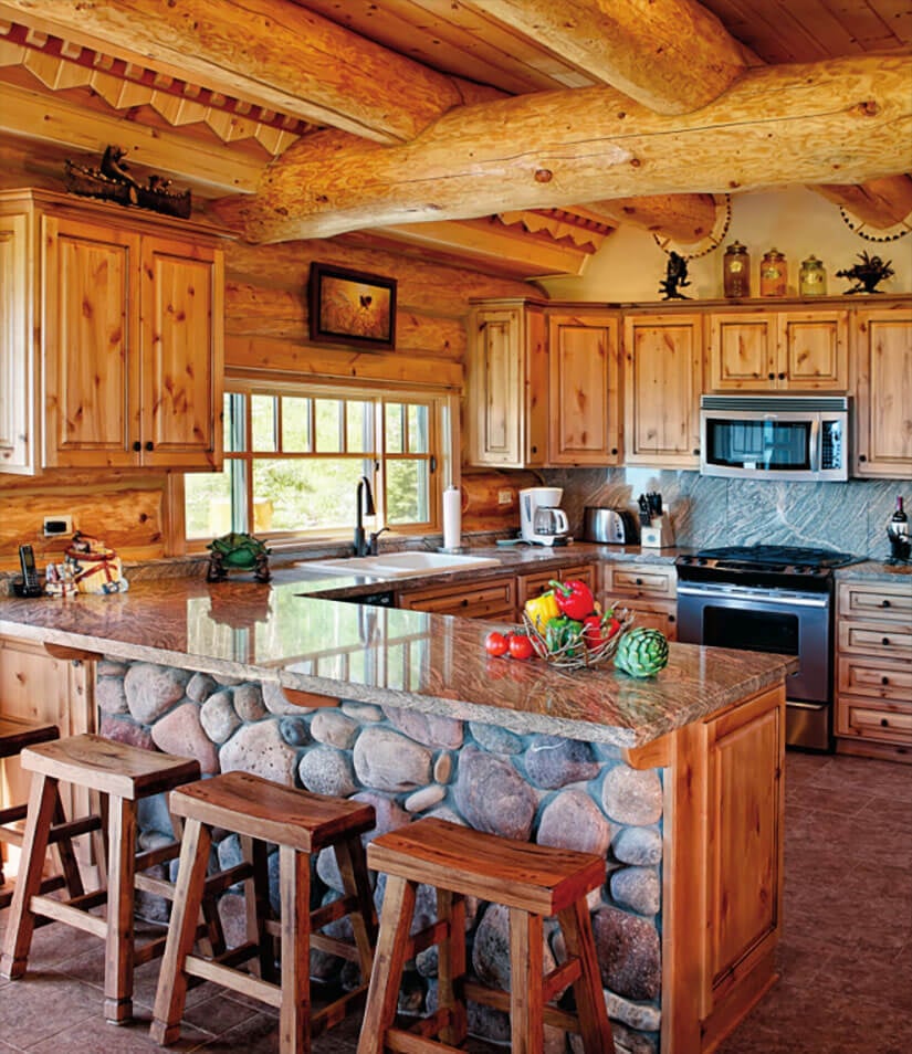 This kitchen's rustic design combines raw wood beams and stone masonry.