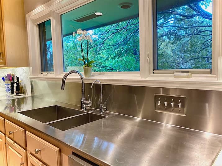 Kitchen sink and stainless steel kitchen countertops.