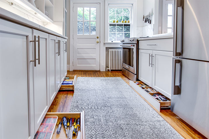 Kitchen cabinets with a usable toe kick area for additional storage.