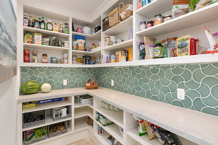 Walk-in pantry with ample storage and counter space.
