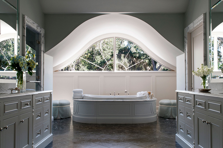 Lunette arch window creates a stunning focal point in the master bath.
