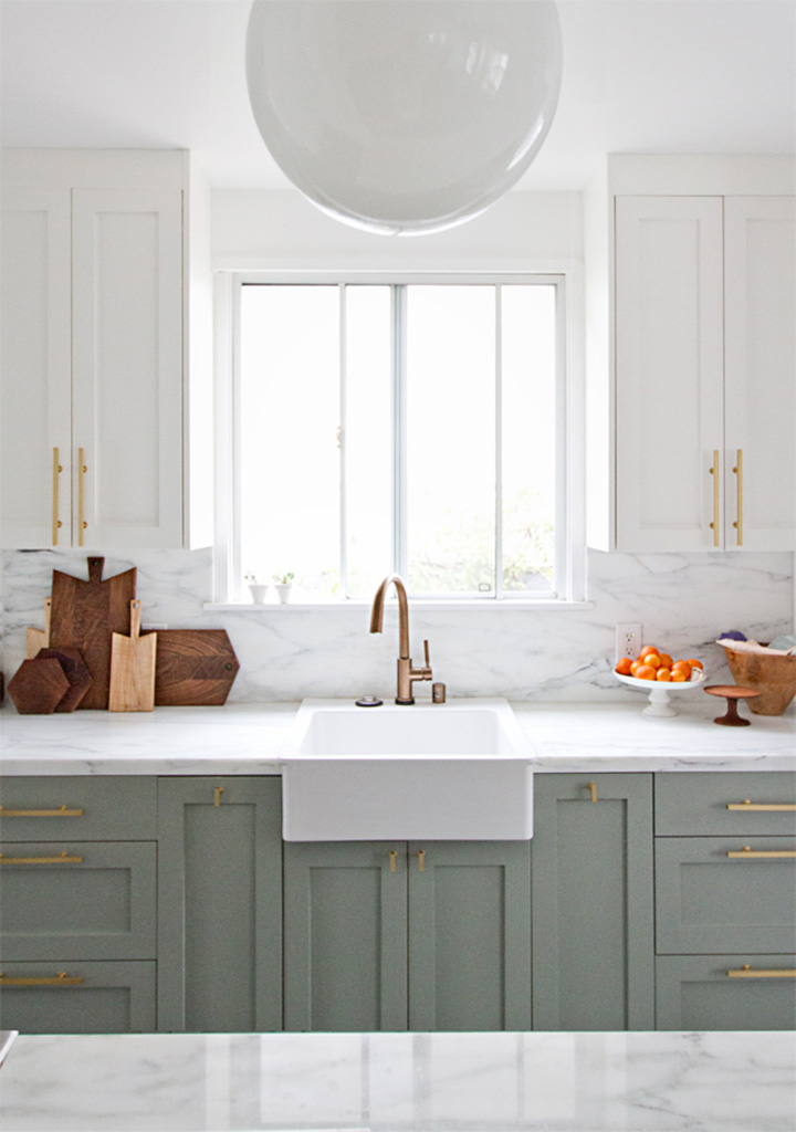 Marble counter, white and gray inset cabinets, gold bar hardware