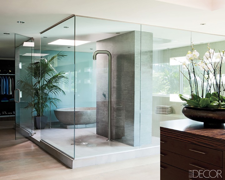 Michael Bay: Glass enclosed shower with stone tiles and free standing tub