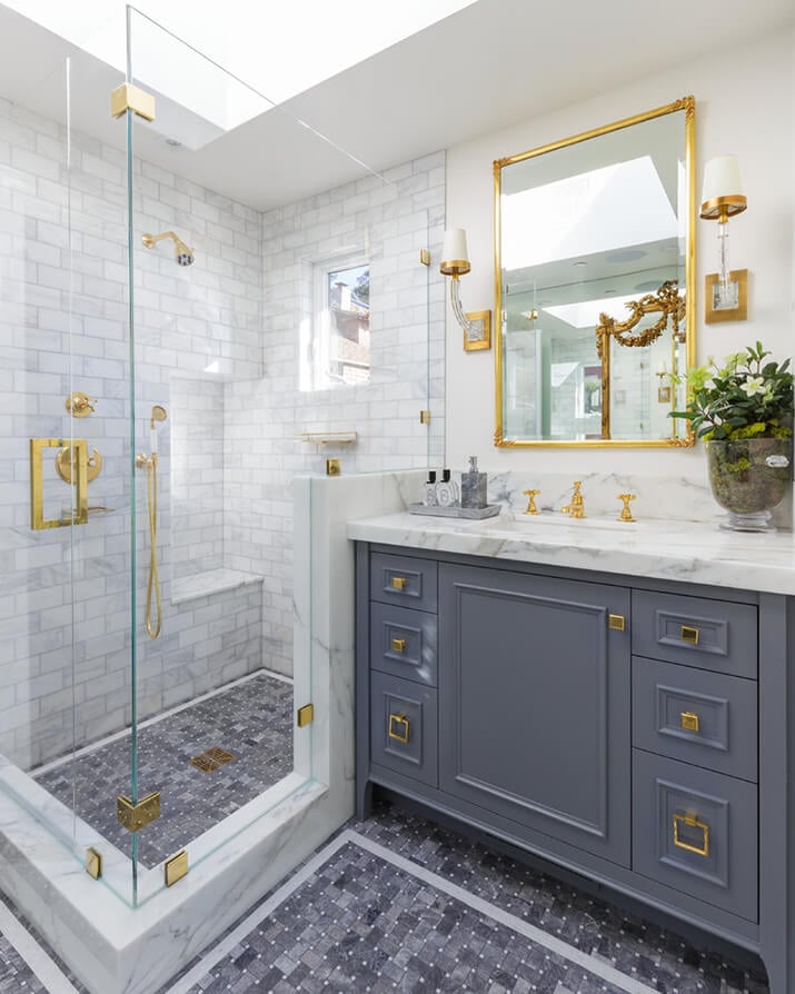 Mid-sized bathroom with timeless white tile and marble tile.