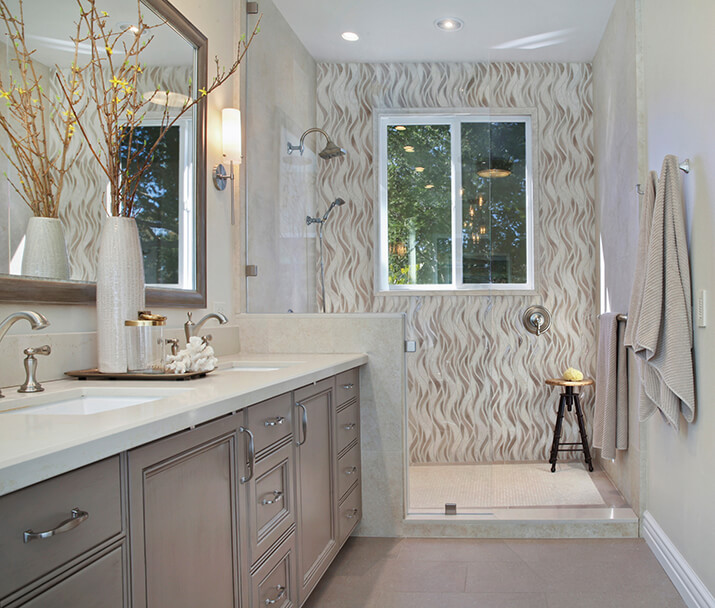 Mid-sized transitional master bathroom with in-drawer outlets for hair tools.
