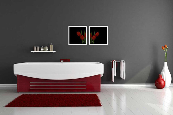 Minimalist gray and red bathroom with lots of empty space.