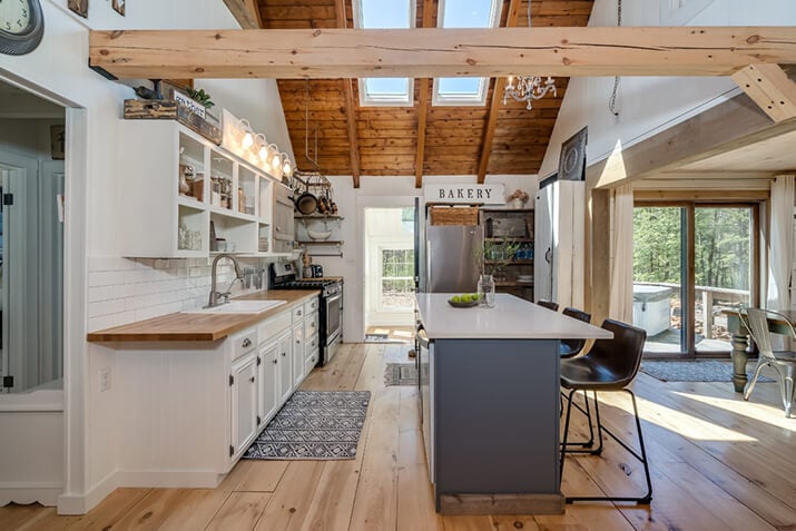 Modern farmhouse kitchen with natural light wood elements and an eat-in kitchen.