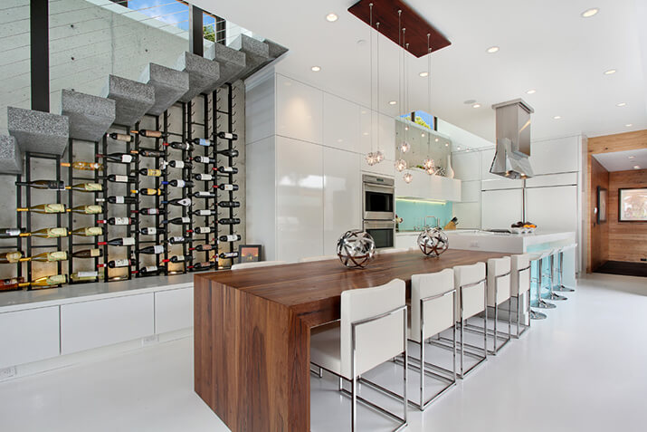 Modern kitchen with a wine rack accent wall.
