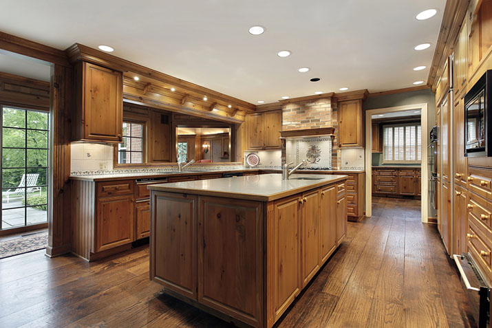 Stylish wood cabinets in modern kitchen.