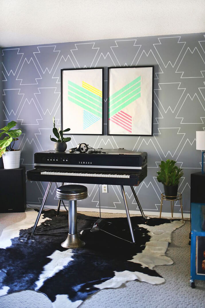 Music room with hand-drawn pattern on wall with paint pen.