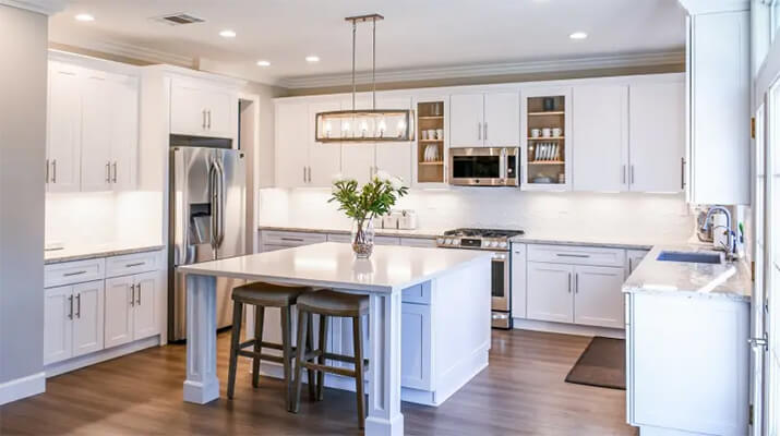 Open concept kitchen with a white color palette.