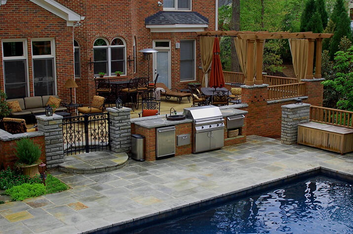 Outdoor kitchen alongside the pool.