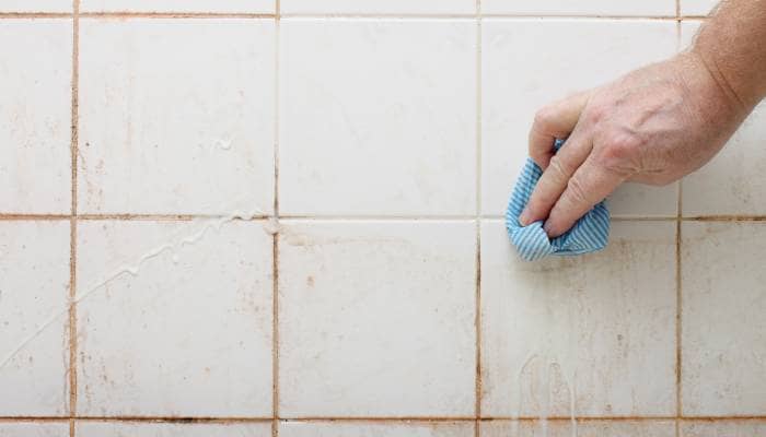 Separately scrape any dirt or grime off the grout.