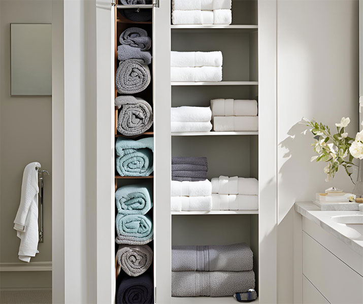 Towel storage recessed back into wall.