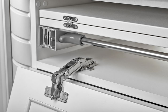 Close up of hinges on cabinet doors.