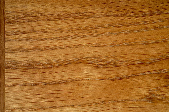 Solid wood cabinet door with natural grain.