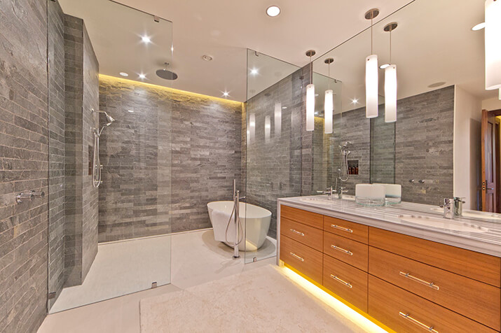 Spa like guest bath featuring walk in shower tub area and heated flooring.