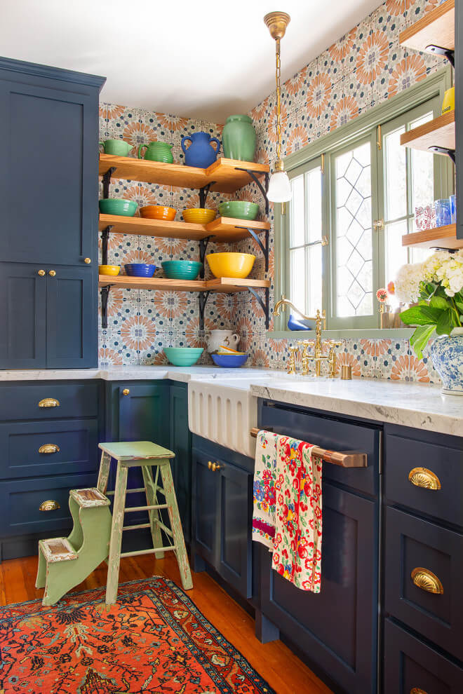 Spanish-style renovation with a multicolored backsplash and open shelving.