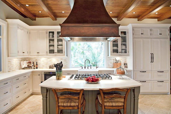 Textured copper kitchen hood design in a traditional kitchen.