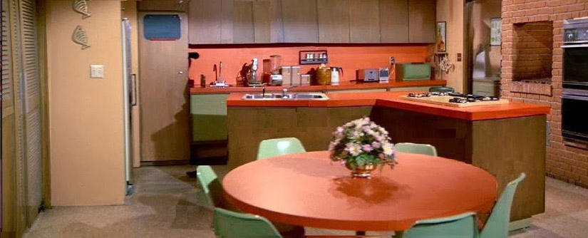 The TV show kitchen on The Brady Bunch epitomizes 70's style with slightly muted orange and green.