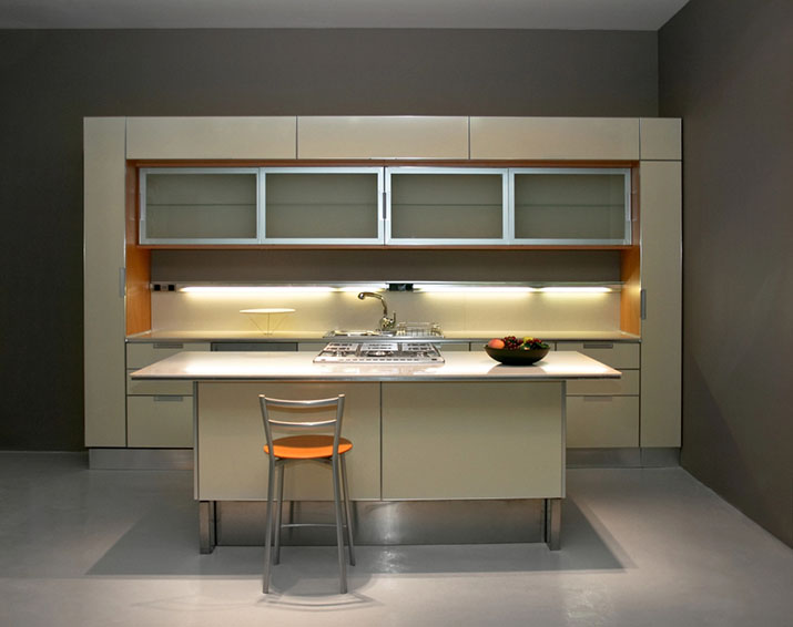 Modern minimalist kitchen with under cabinet lighting.