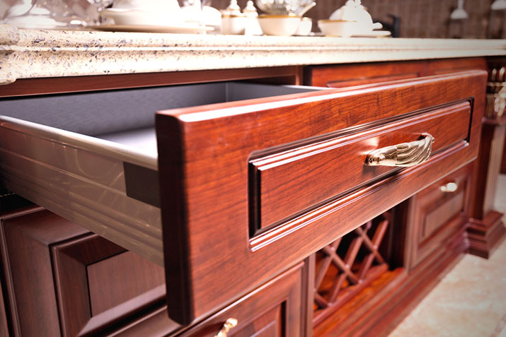 Unique drawer pull on gorgeous wood drawers.