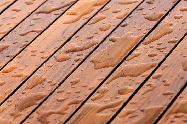 Waterproofed wood deck repelling moisture