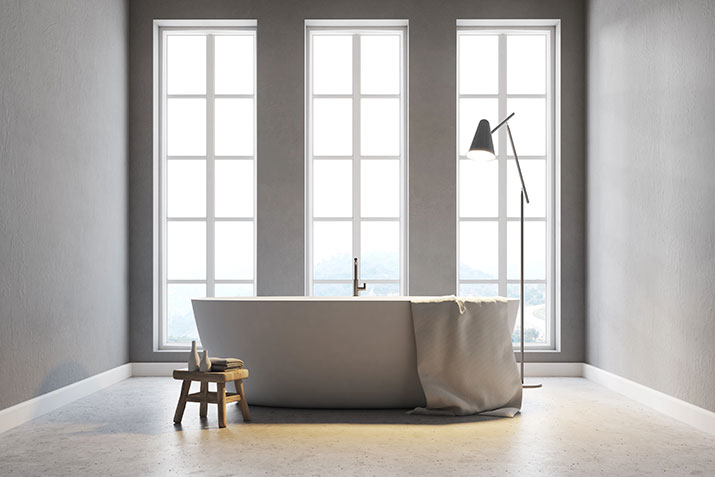 A clean white freestanding bath tub.