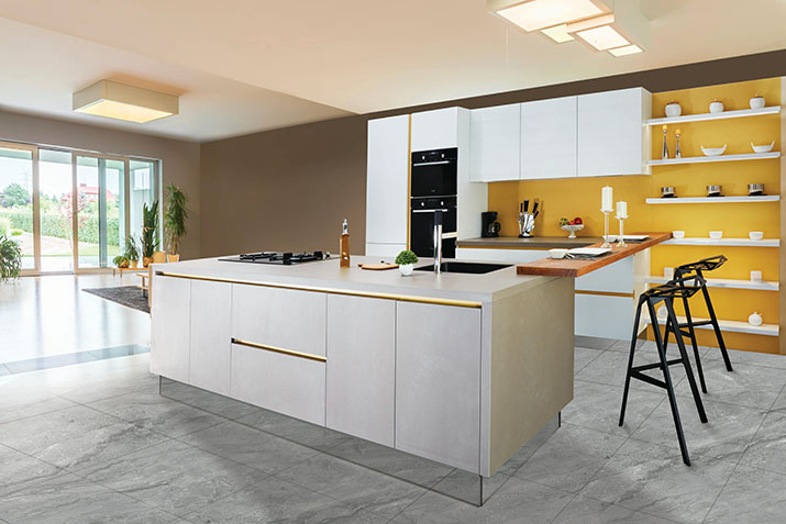 White island in a yellow and beige kitchen.