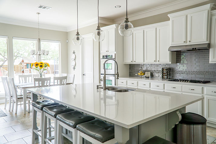 White kitchen island in modern kitchen.