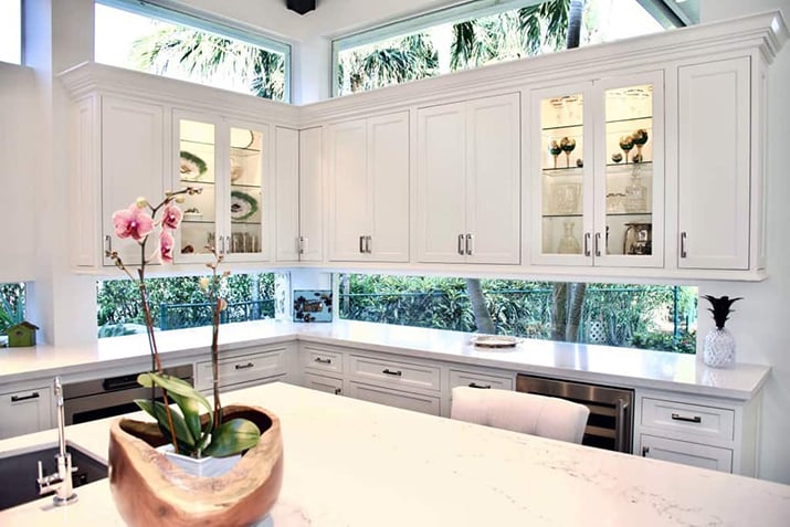 White kitchen with two wall window backsplash.
