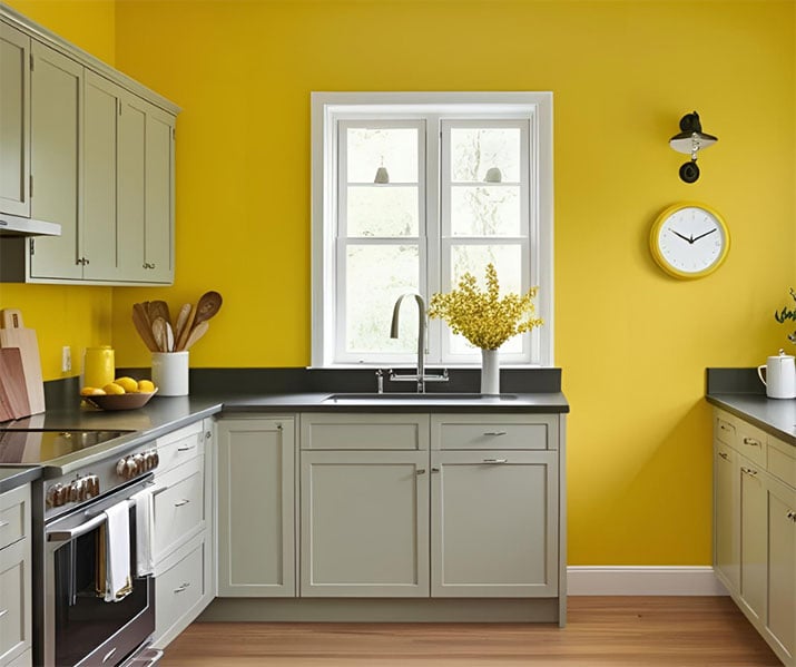 A yellow accents wall in a sunny kitchen.